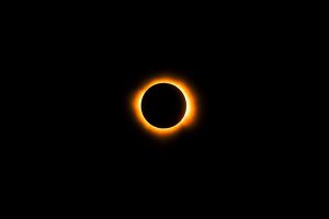 Stunning visual representation of a solar eclipse similar to what viral posts claim about the solar eclipse August 2025, showing the Sun completely covered by the Moon, creating a glowing corona ring in a dark sky.